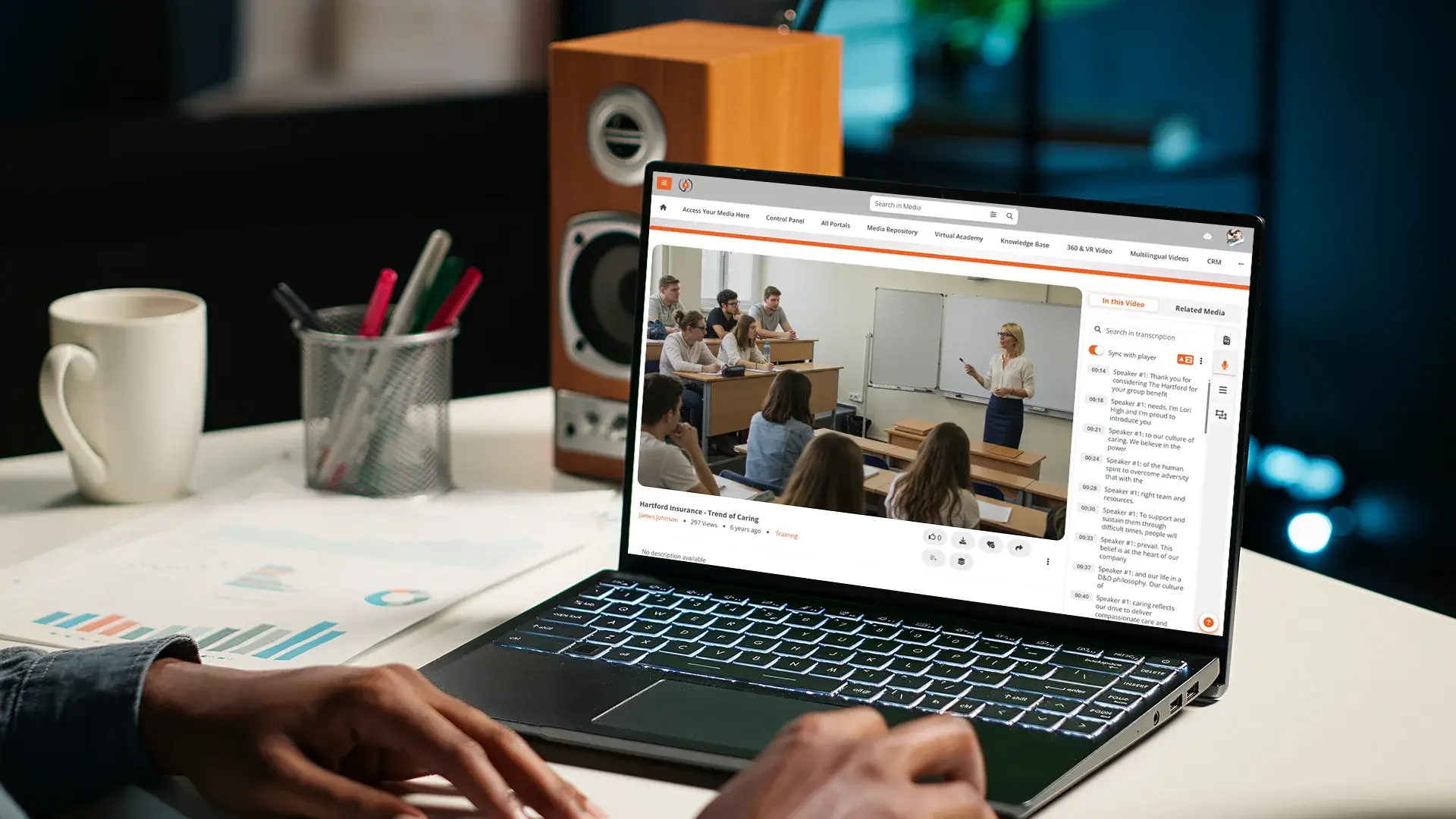 EnterpriseTube player showing a classroom lecture video with a synced, searchable transcript panel beside it.