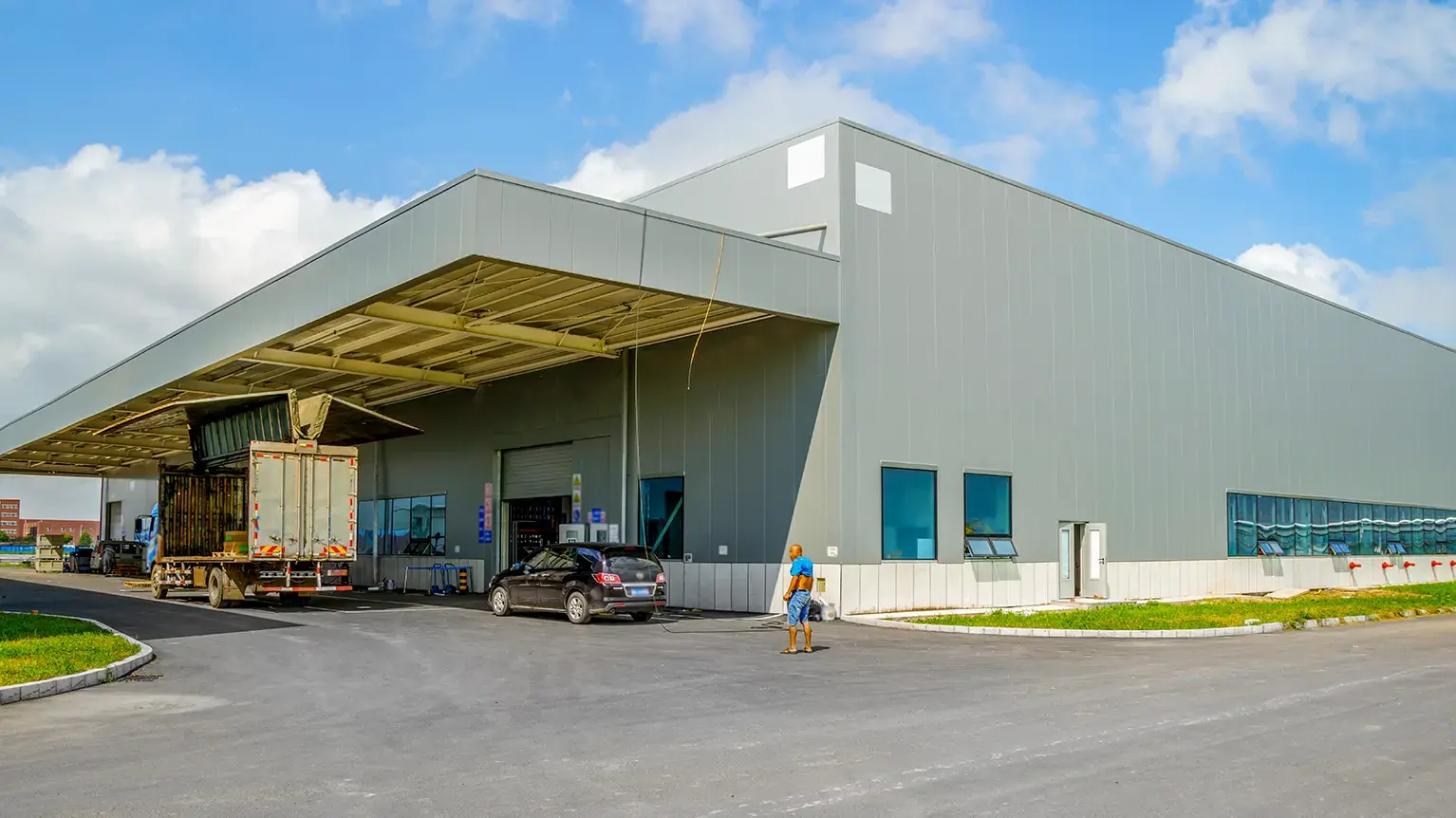 Americold facility with loading docks and trailers, showcasing the company’s role in temperature-controlled warehousing and logistics services