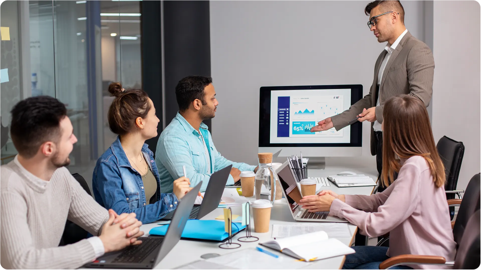 Employees watching a business presentation in a meeting room