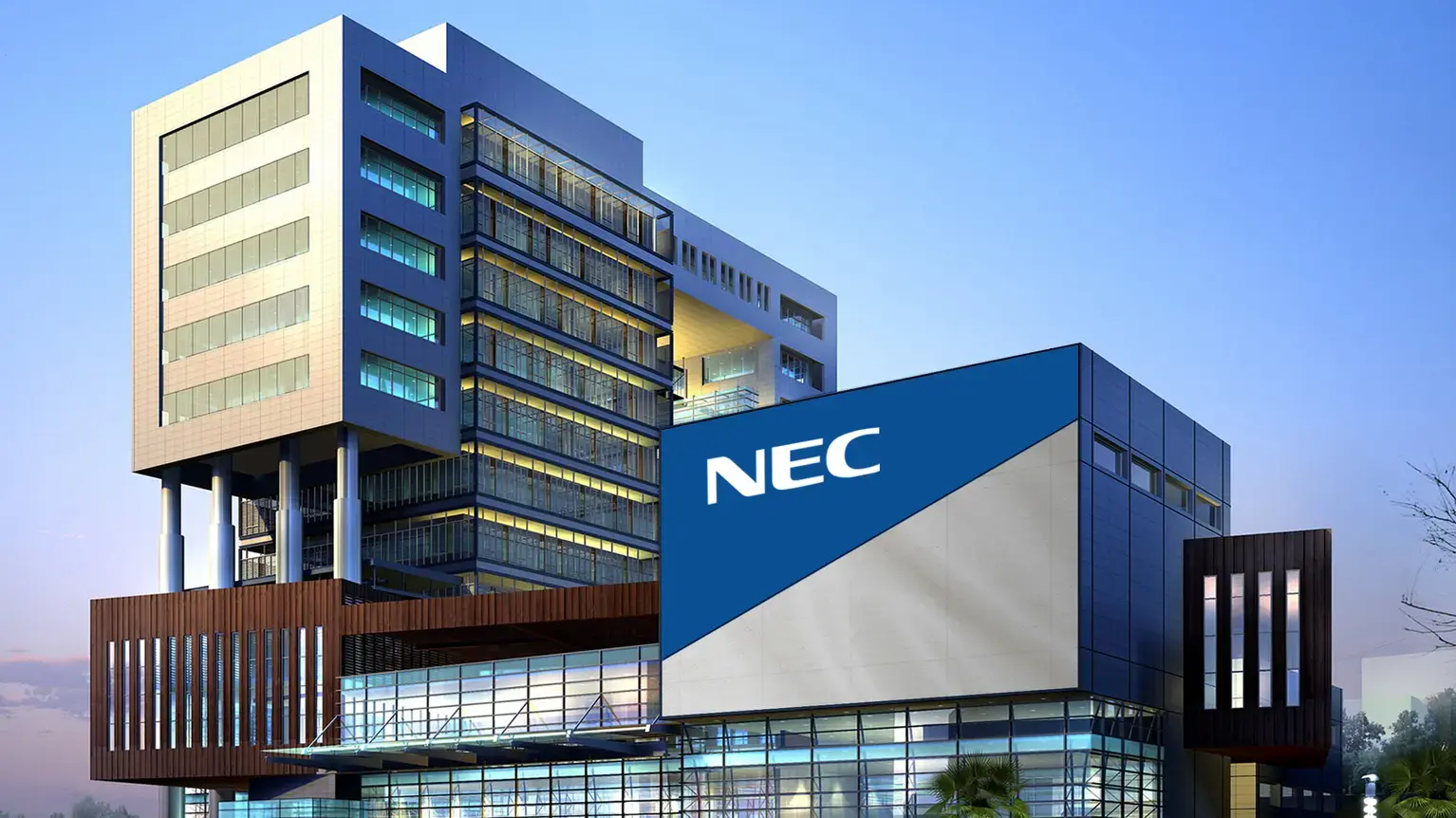  The NEC building logo on a modern white structure against a clear blue sky, representing NESIC's technology and communications services