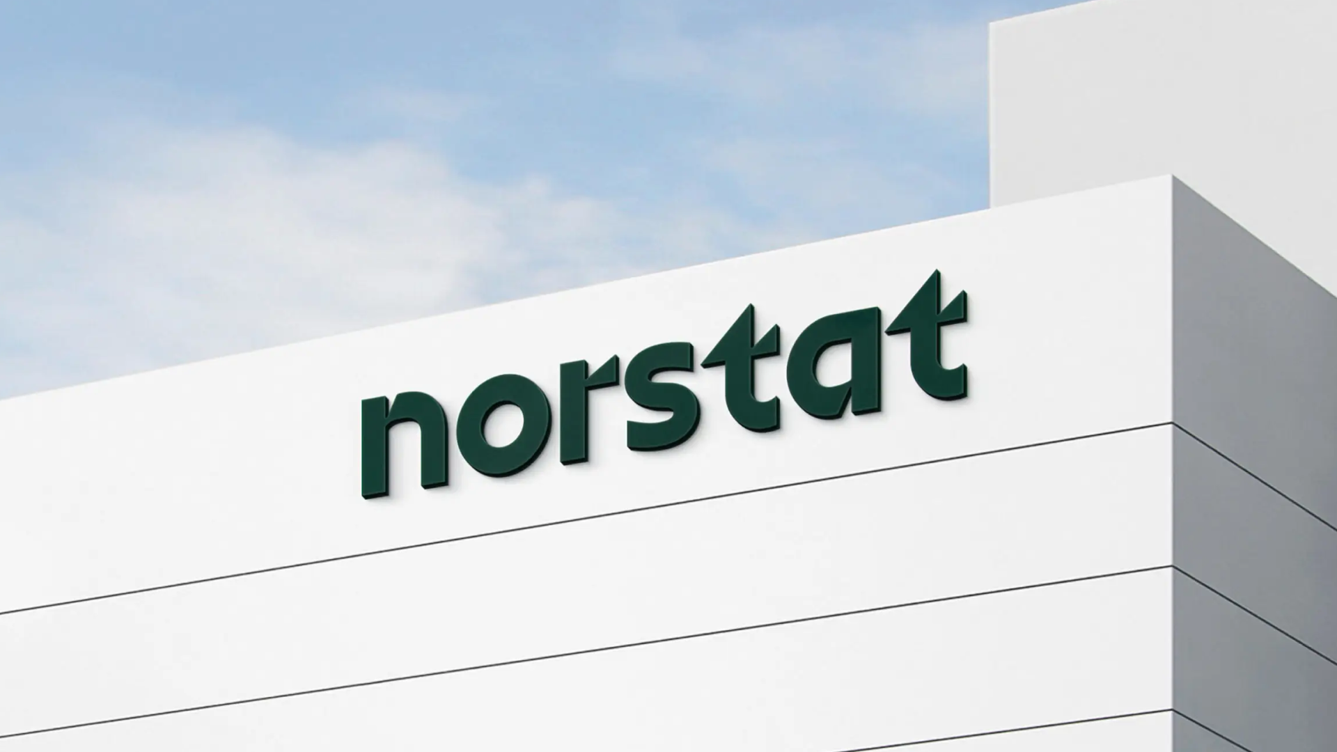 Building exterior with the Norstat logo in dark green, representing a data collection and market research company