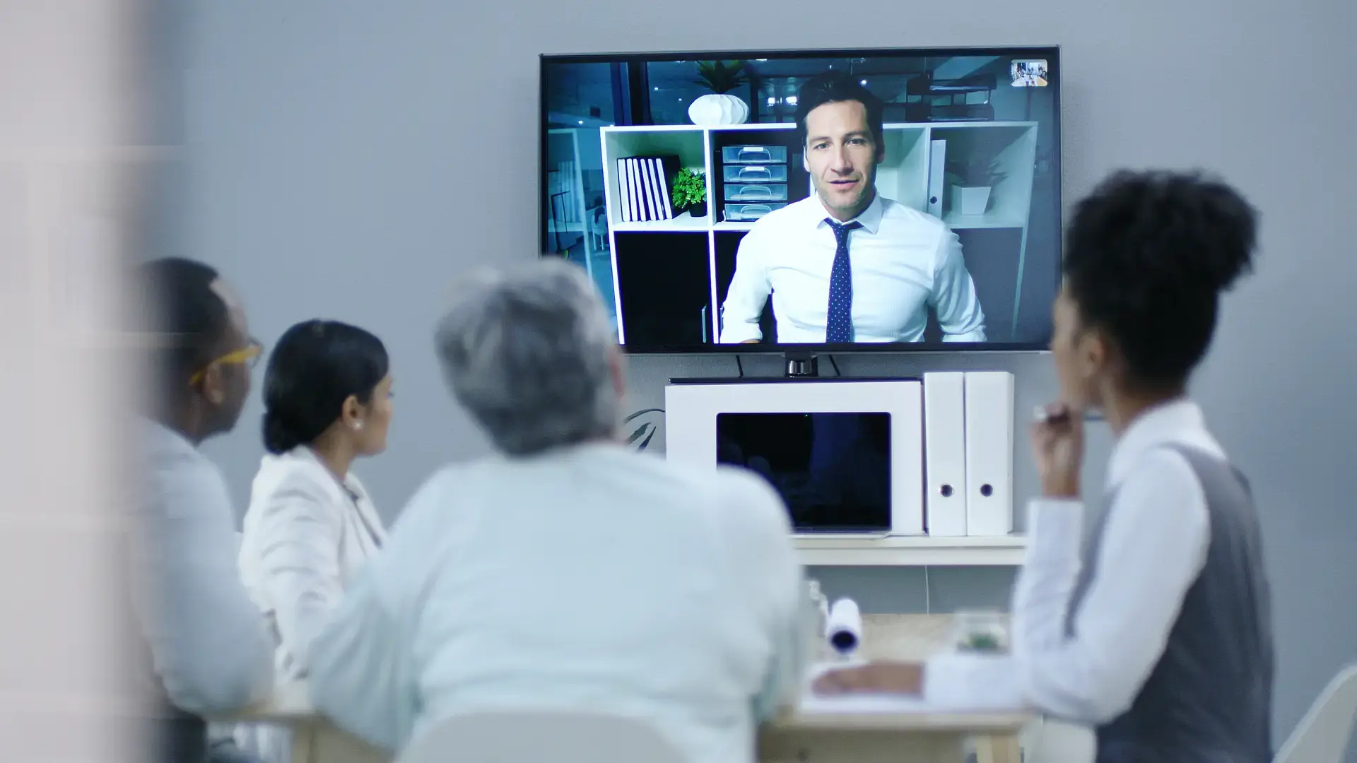a group of people watching their company video