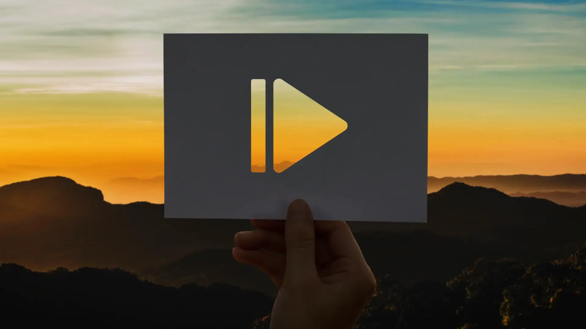 a person holding a video play icon